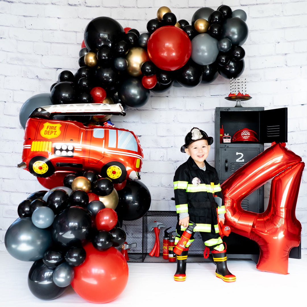 Black white and grey balloon garland with firetruck balloon and a red 4 balloon